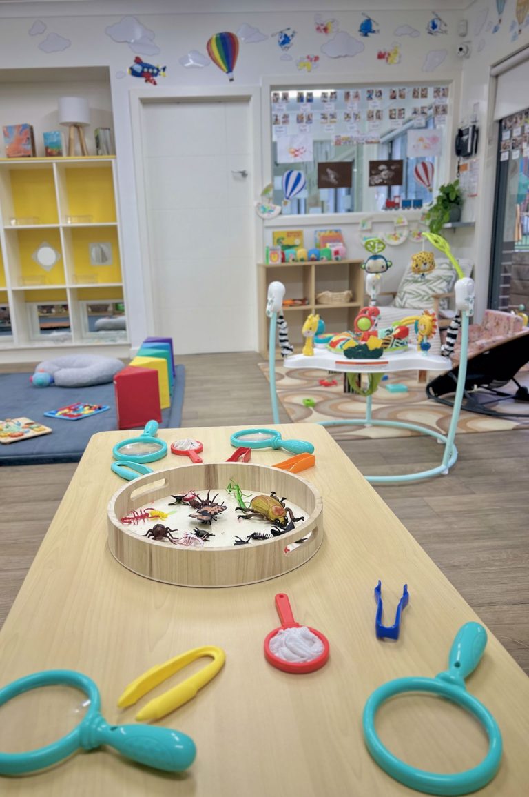 Babies exploring in Joey's Room (0-1 years) at Macarthur Early Learning
