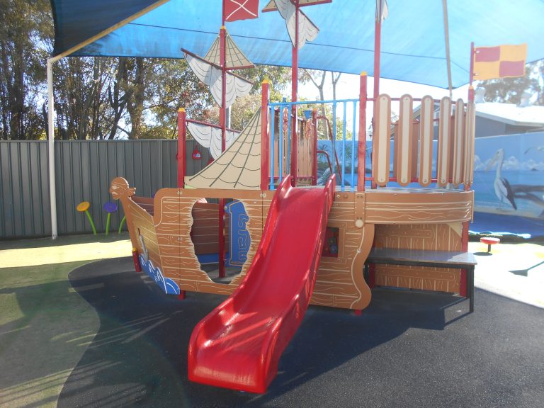 Children playing in the outdoor playground at Macarthur Early Learning